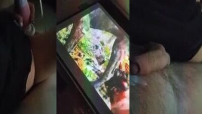 Couple masturbate to dog porn together