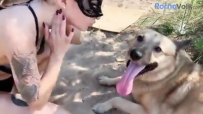 Beauty Sonya on the seashore with a dog