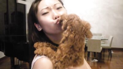 Girl kissing dog