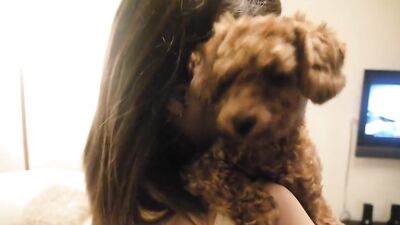 Girl kissing dog