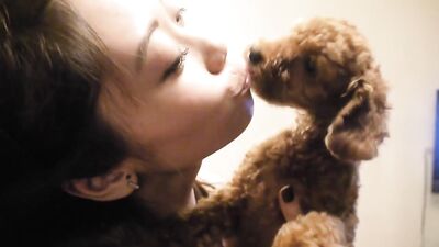 Girl kissing dog