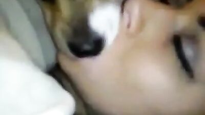 Beautiful girl french kiss with dog