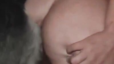 A minx sucks her dog’s cock and swallows his sperm