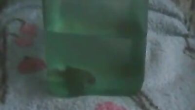 Young girl inserts a live fish into her ass