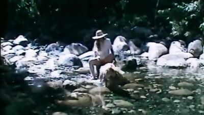 Housewife fucks dog on rocks at the beach