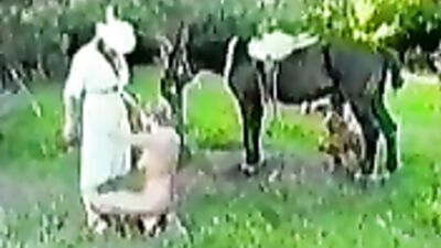 A farmer with his horse and two girls