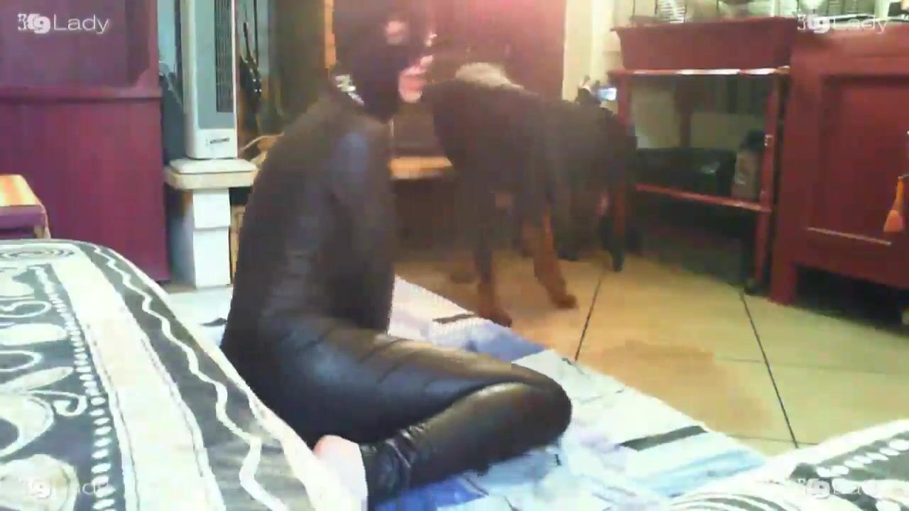 Latex Mistress Dominates Canine Lover
