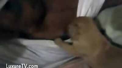 Black woman breastfeeding puppy
