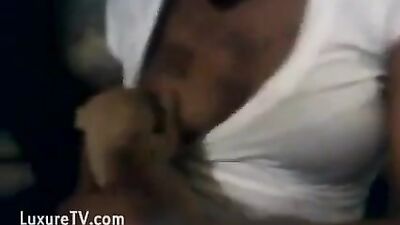 Black woman breastfeeding puppy