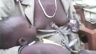 Mother breastfeeding a monkey