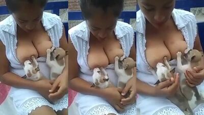 Chinese Woman Breastfeeding Two Hungry Puppy