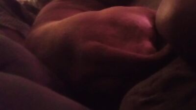 Couple and dog laying down on couch together